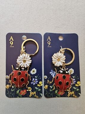 NWT Lot of Two Avenue 9 Red Ladybug & White Daisy Keychain with Gold Hardware